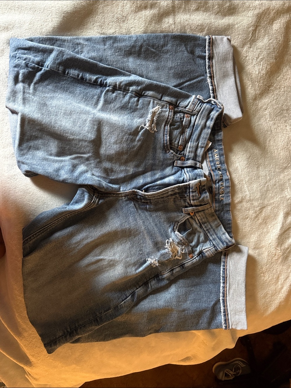 American Eagle Outfitters light blue denim shorts with tan stitching
